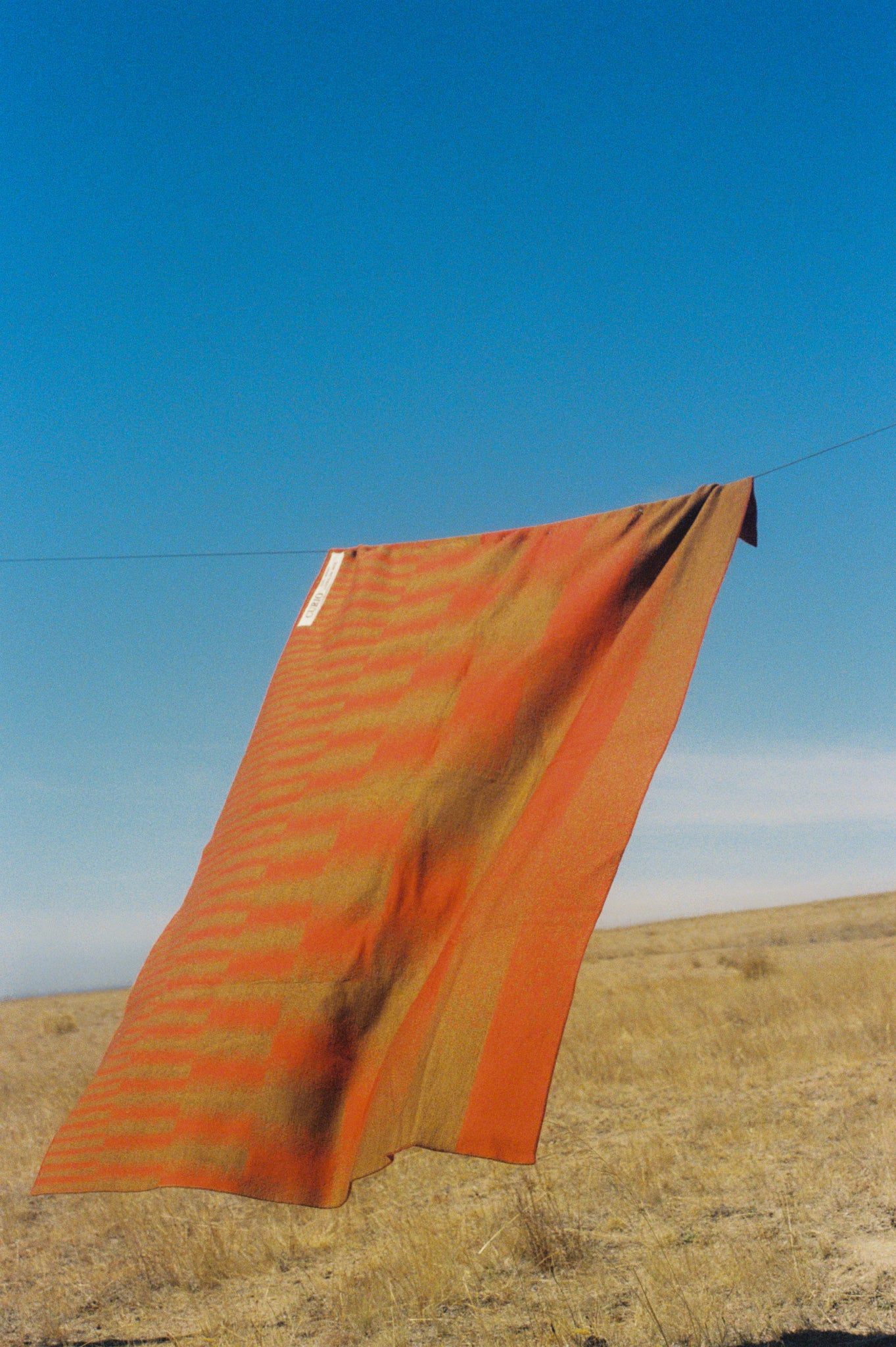 Australian wool blanket with red stripe, handmade in Melbourne