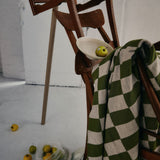 Green and Wheat Checkered pattern merino wool blanket. The Blanket is knitted in Melbourne by a skilled team of makers. The blankets use 2kgs of merino wool making them heavy and lush, unlike anything else.