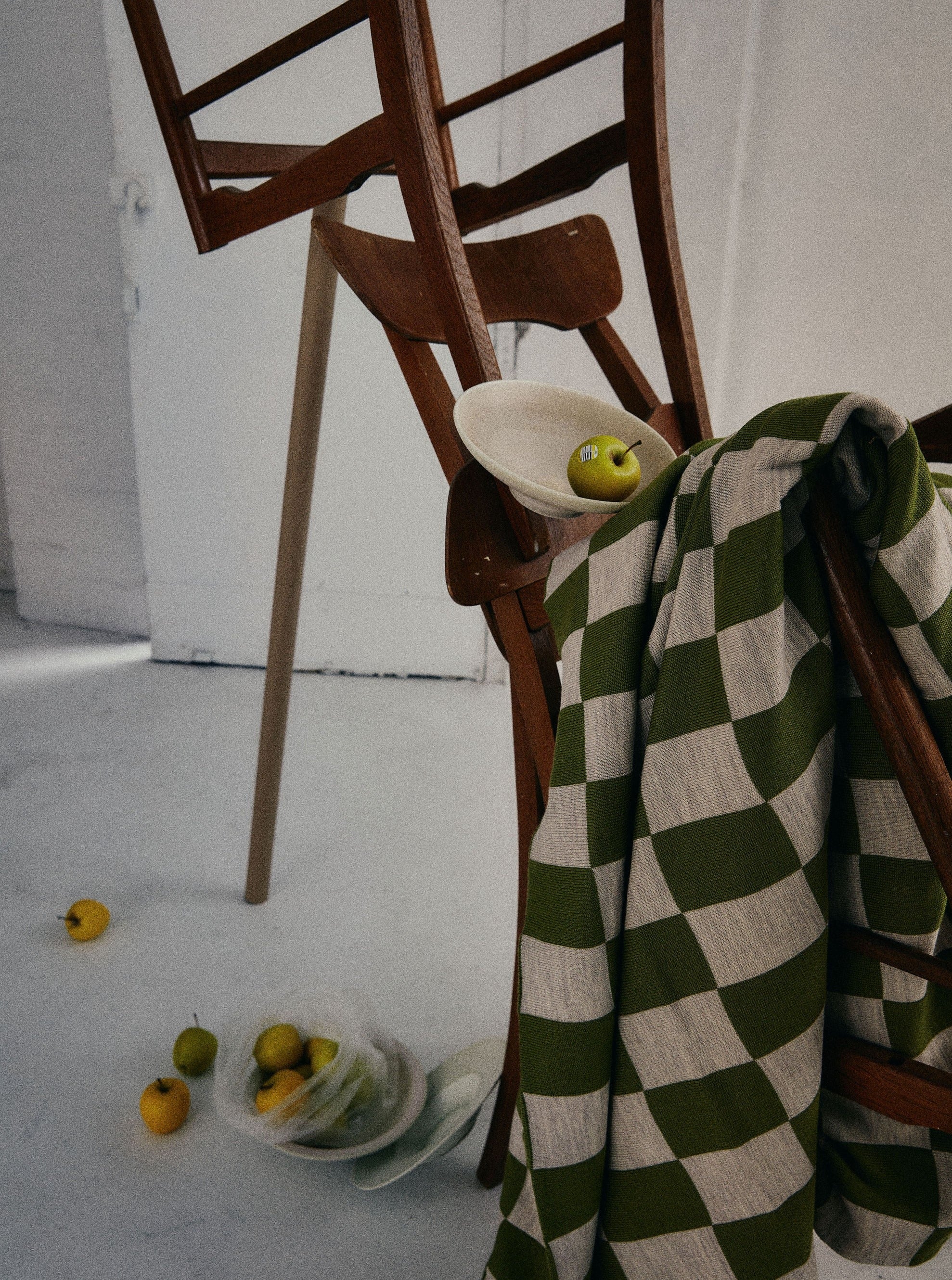 Green and Wheat Checkered pattern merino wool blanket. The Blanket is knitted in Melbourne by a skilled team of makers. The blankets use 2kgs of merino wool making them heavy and lush, unlike anything else.