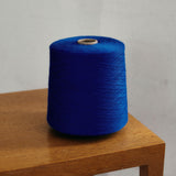 A blue Check merino wool blanket. Bright and rich in colour and handfeel. The blanket is 2kg of the finest Australian Merino wool. sizes baby, queen and king.