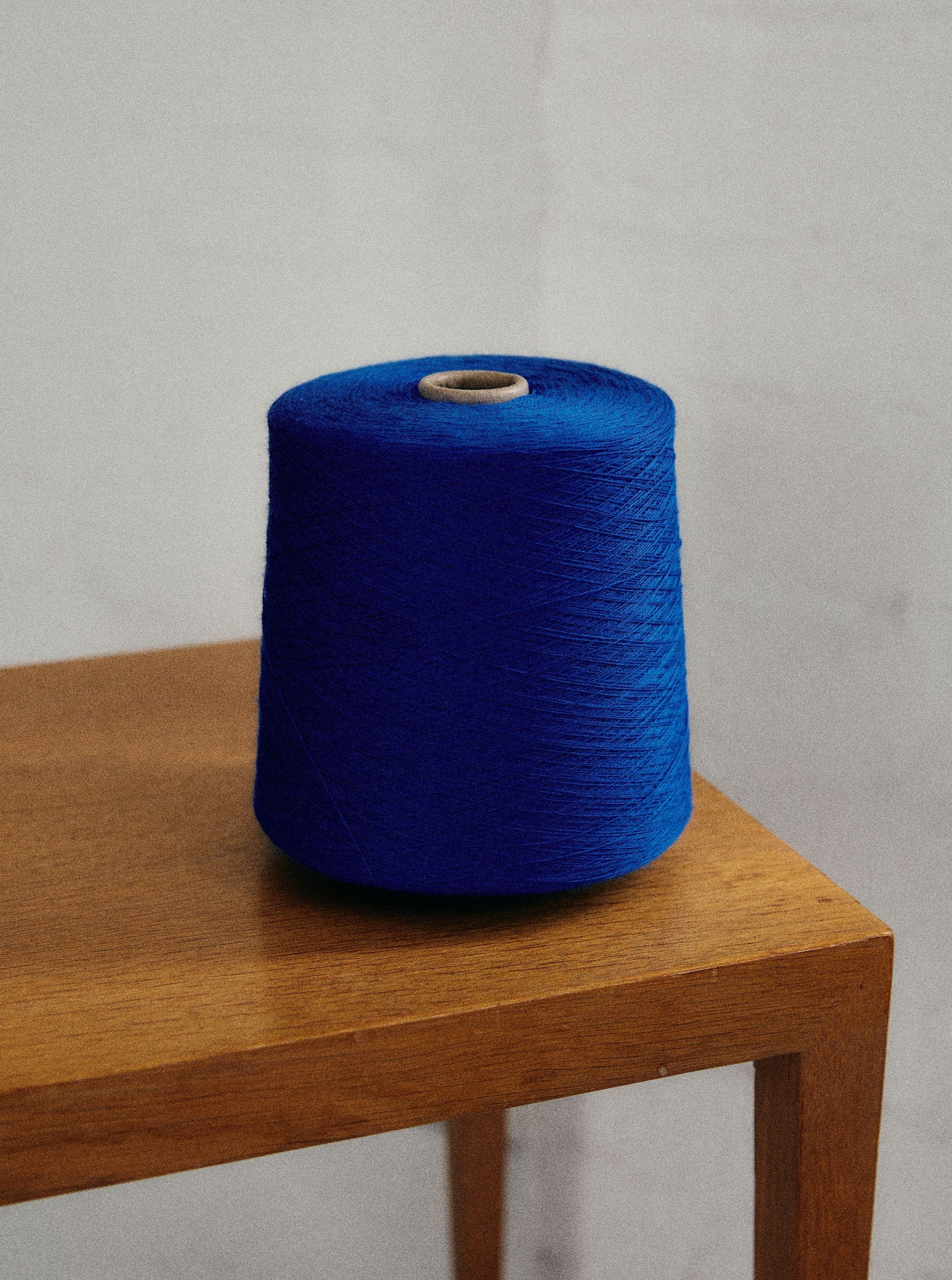 A blue Check merino wool blanket. Bright and rich in colour and handfeel. The blanket is 2kg of the finest Australian Merino wool. sizes baby, queen and king.