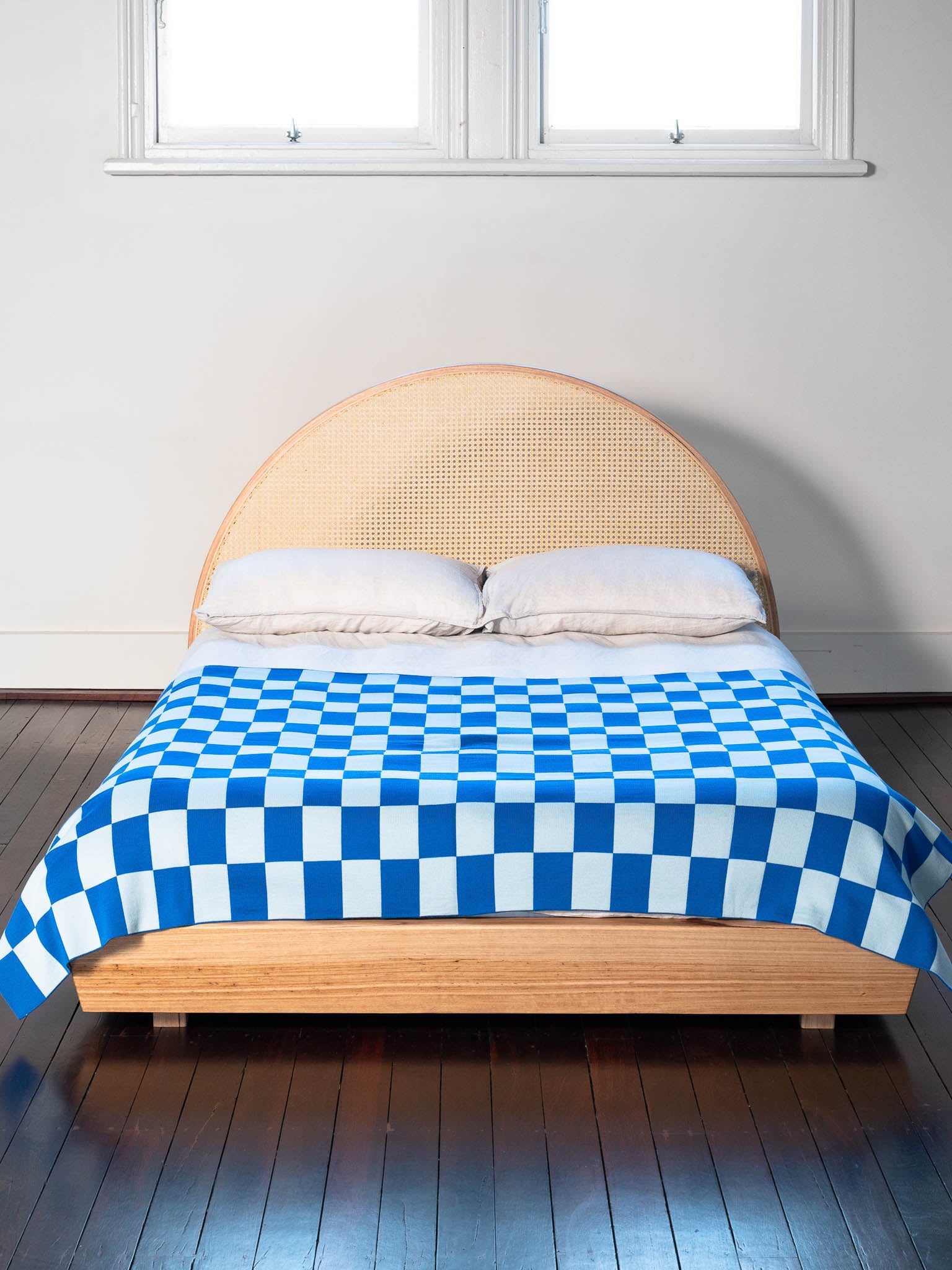 A blue Check merino wool blanket. Bright and rich in colour and handfeel. The blanket is 2kg of the finest Australian Merino wool. sizes baby, queen and king.