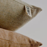 heirloom Australian wool and cotton, each yarn showcases a unique texture and colour, resulting in a durable and weighty fabric. Hand-stitched by skilled technicians in Brunswick, Victoria, this cushion boasts refined accents, such as an elegant gold zipper and a meticulously hand-embroidered Curio label. Designed to stand the test of time, elevate your home decor with this exquisite piece of craftsmanship.