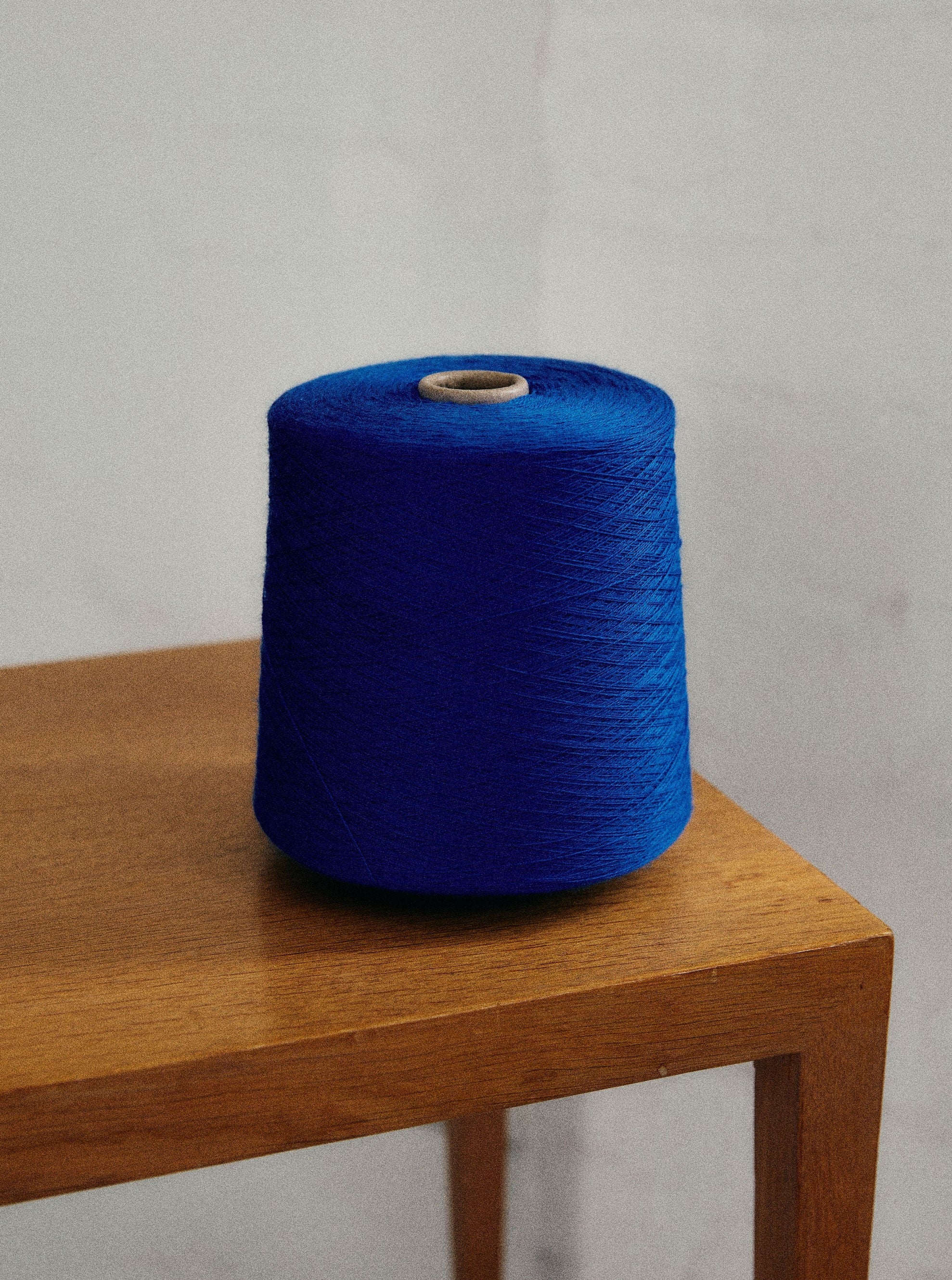 A blue Check merino wool blanket. Bright and rich in colour and handfeel. The blanket is 2kg of the finest Australian Merino wool. sizes baby, queen and king. 